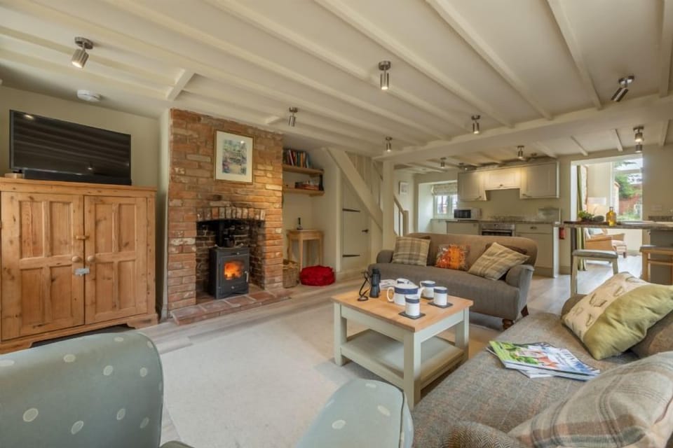 Ground floor: Cosy sitting room with wood burning stove