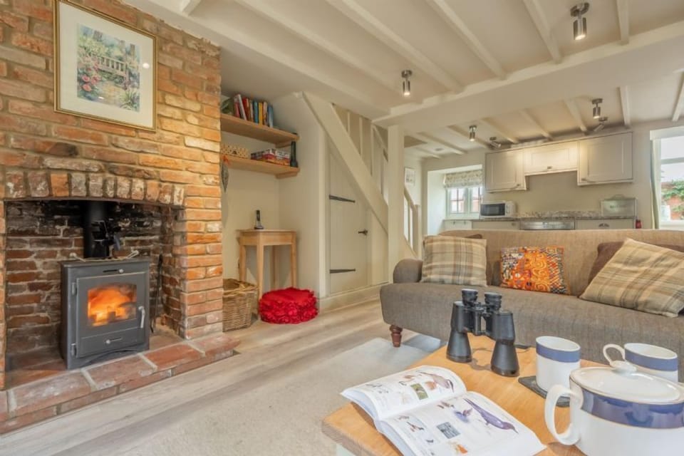 Ground floor: Cosy sitting room with wood burning stove