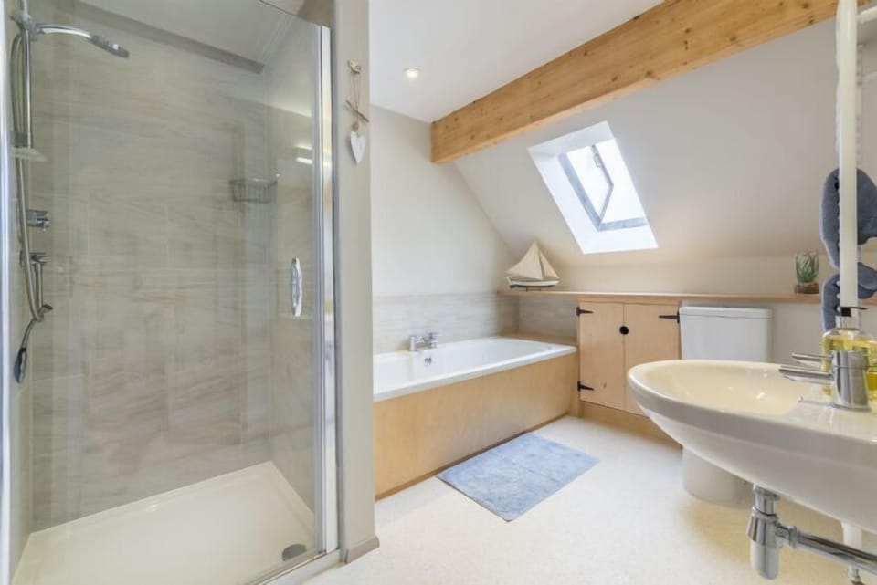 First floor: Family bathroom with bath and separate shower