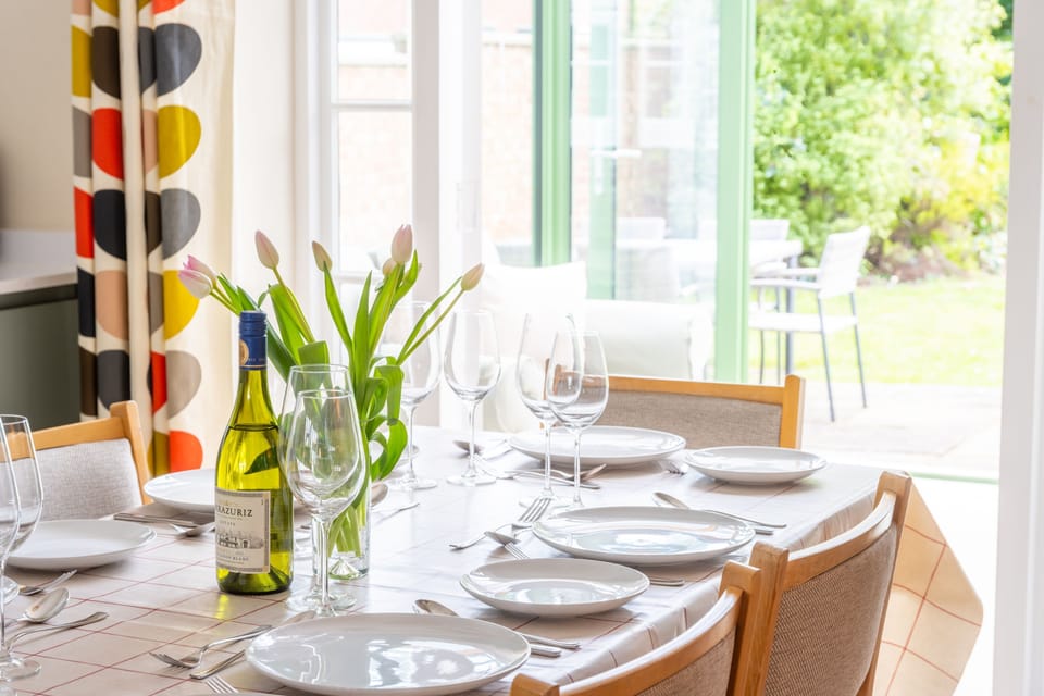 Ground floor: Dining area looking to the garden through the conservatory