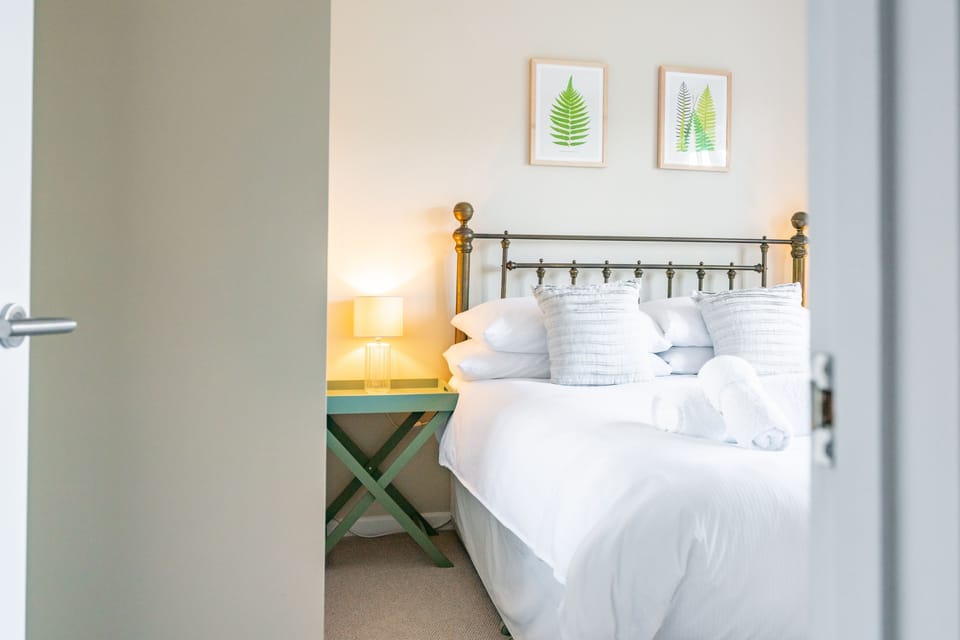 First floor: Master bedroom with king-size bed