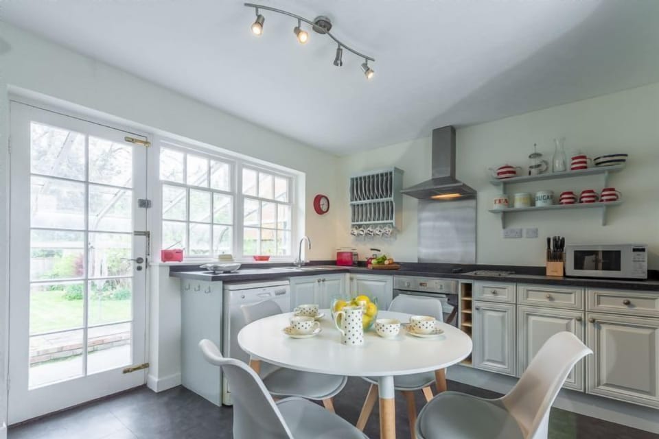 Forge Cottage, Thornham: Well-equipped kitchen with doors to garden