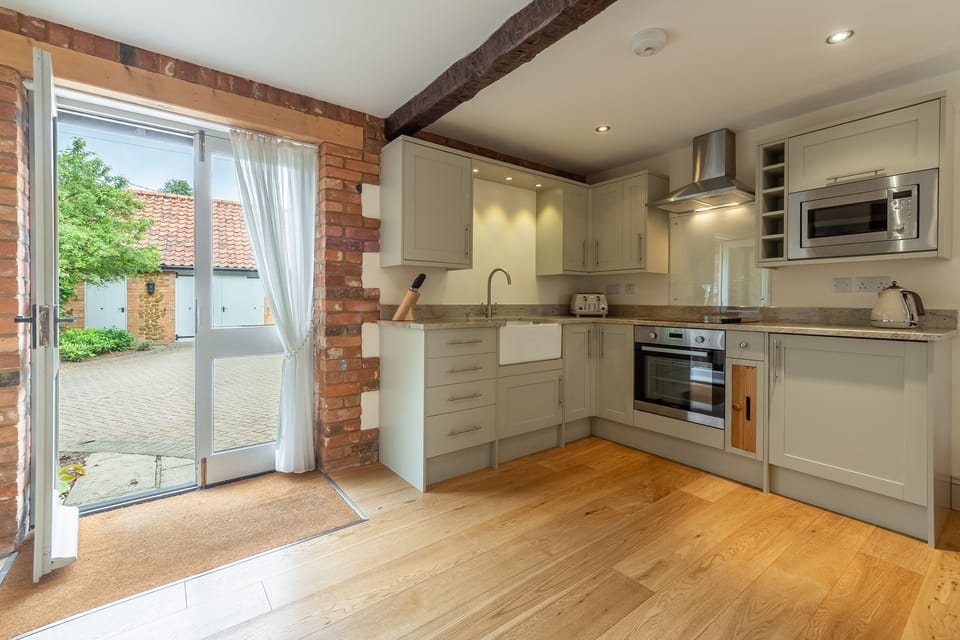 Kitchen area with beamed ceiling