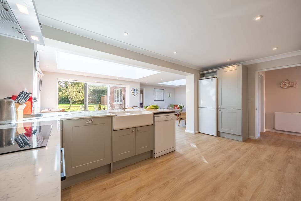 Kitchen with dining area and garden beyond