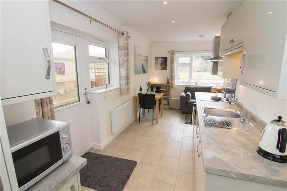 Ground floor:  Open-plan living area with door to outside