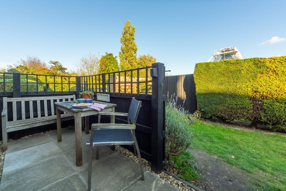 The courtyard garden has table and seating area