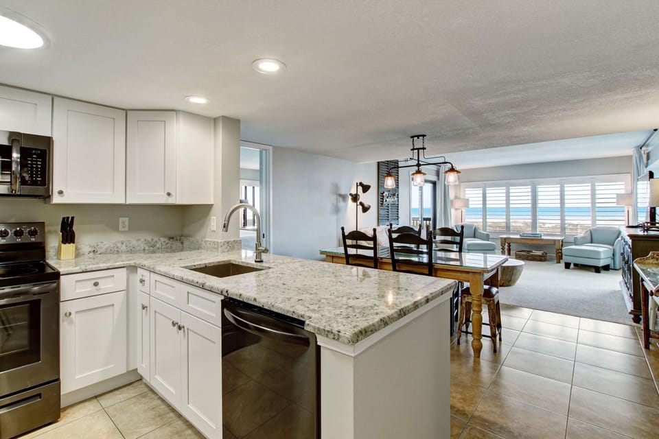 Upgraded Kitchen Featuring Granite Countertops and New Stainless Steel Appliances