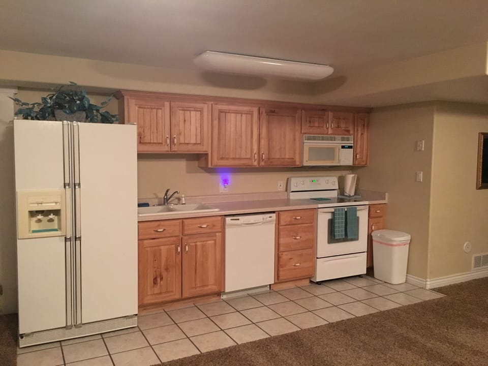 Kitchen w/ dishes, glassware, cooking utensils 