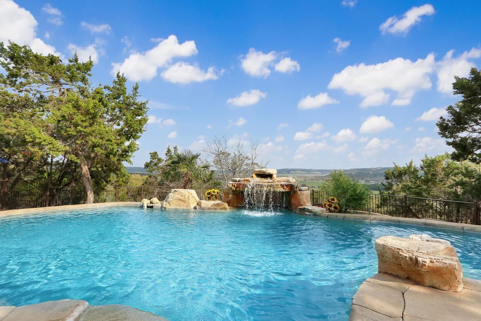 Enjoy the warm summer days from this crystal clear pool