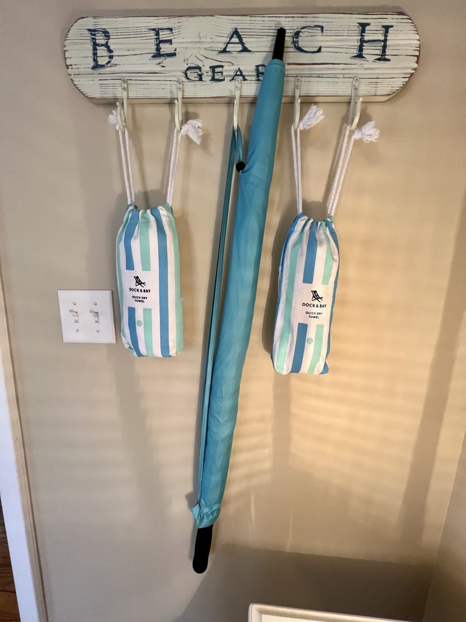Nesters enjoy an umbrella for two & XL sand free micro towels for the beach/park