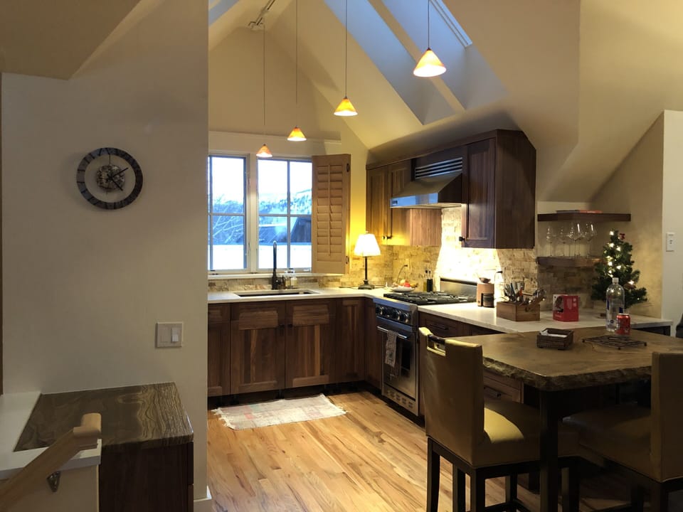 Kitchen Renovation all new Walnut Cabinets seating  4 on the sandstone high top