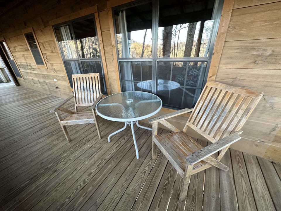 Cozy porch with rustic wooden charm with a table for two