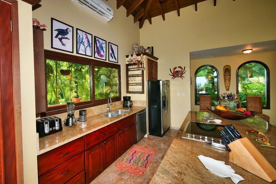 Spacious kitchen with vibrant garden views and rustic charm