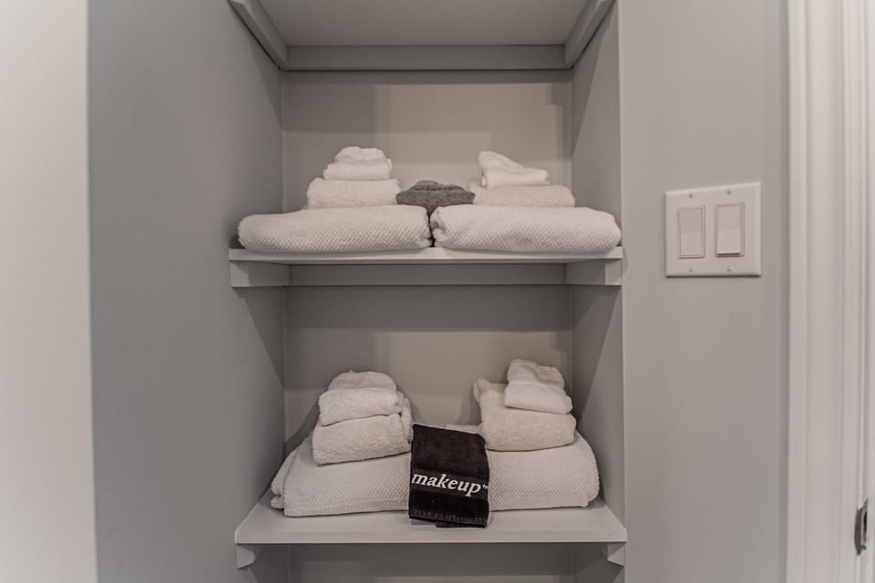 Towels provided as well as NEOB lavender all-in-one liquid soap and shampoo - La Vignette Vacation R