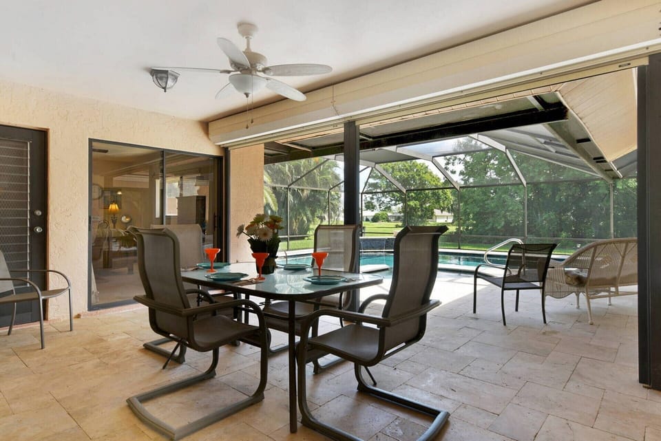 There are two dining areas by the pool, both with room for 4