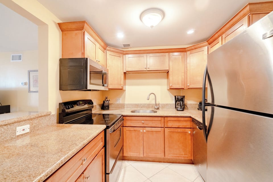 Granite counter tops dishwasher, microwave, range and refrigerator w/ icemaker. 