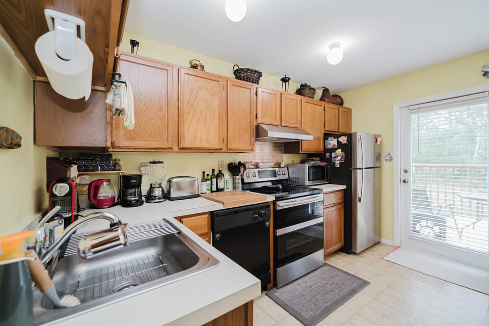 Plenty of dishes, glasses, cookware bakeware, and dishwasher
