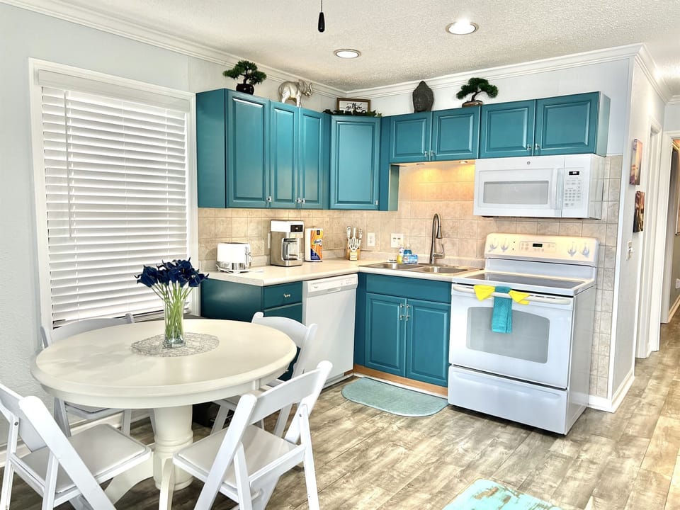 Kitchen is fully equipped with full-size appliances, dinnerware, cookware, regular coffee maker, ninja blender, etc.  