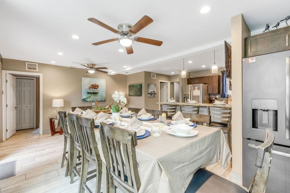 Dining: Expansive dining area and kitchen bar seating to accommodate large meals.