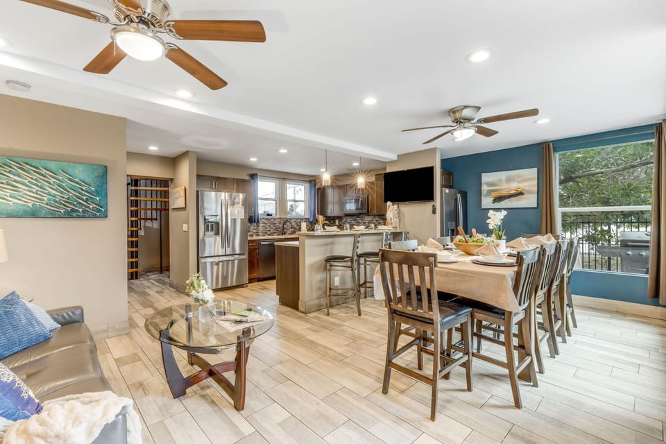 Dining: Expansive dining area and kitchen bar seating to accommodate large meals.