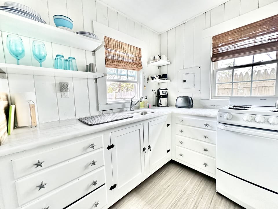 Renovated kitchen w/ marble counters. New stove, fridge & washer/dryer.