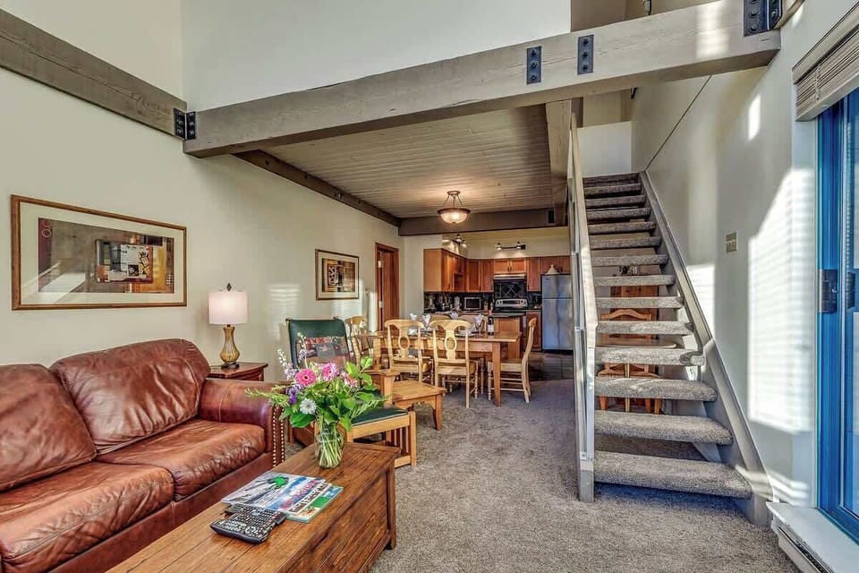 Living Room with Stairs to Loft Bedroom - Greystone Lodge Unit 401