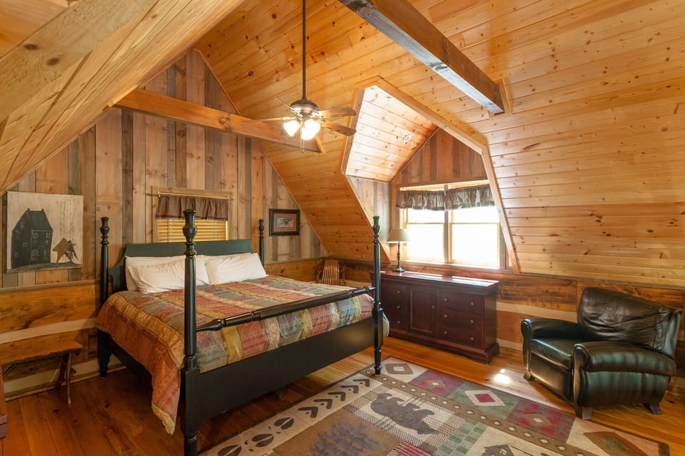 Loft bedroom with king size bed. Open the windows to hear the creek at night