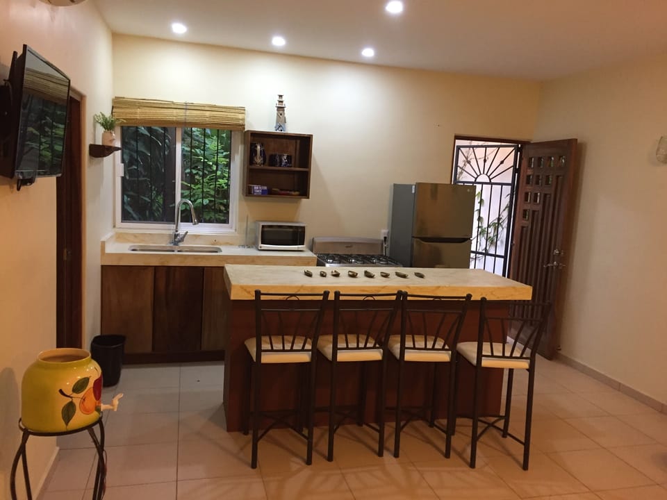 Kitchen, sink window opens and has view to properties gardens 