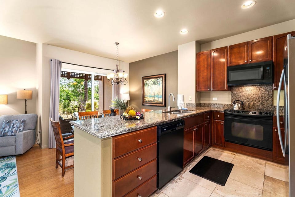 The main level offers an open living area, dining space, well-equipped kitchen, and convenient half bath