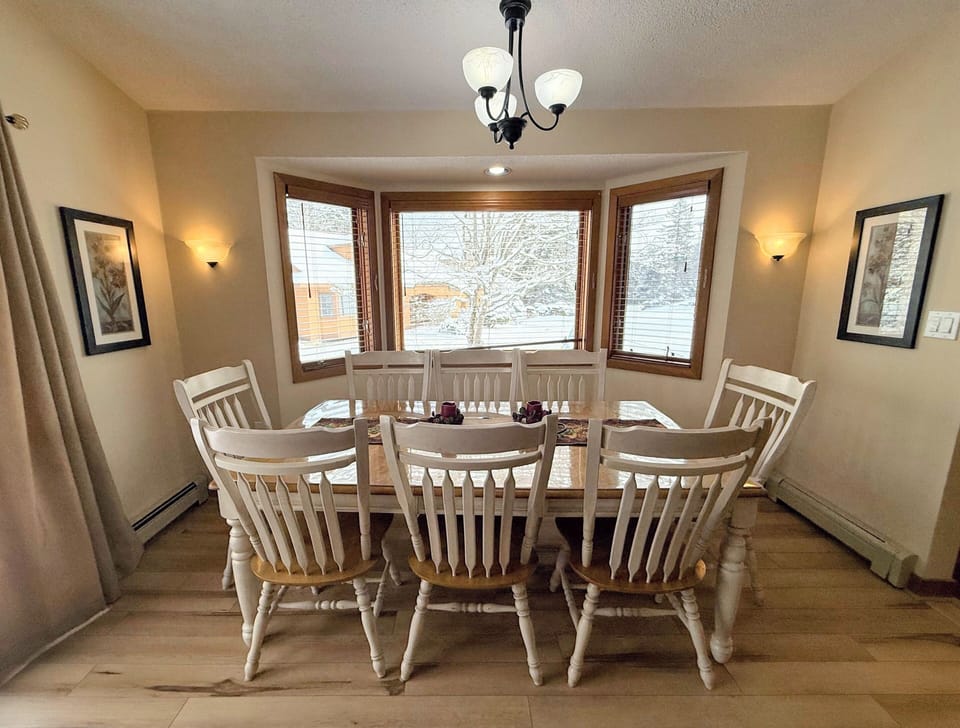 Dining/Living Area: Open concept space offers dining table with room for 8 and comfortable couches to relax by the stone fireplace. TV with high speed wi-fi included.