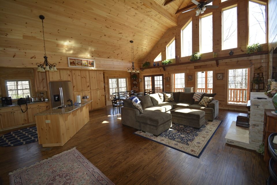 View of the main floor living room with open air kitchen