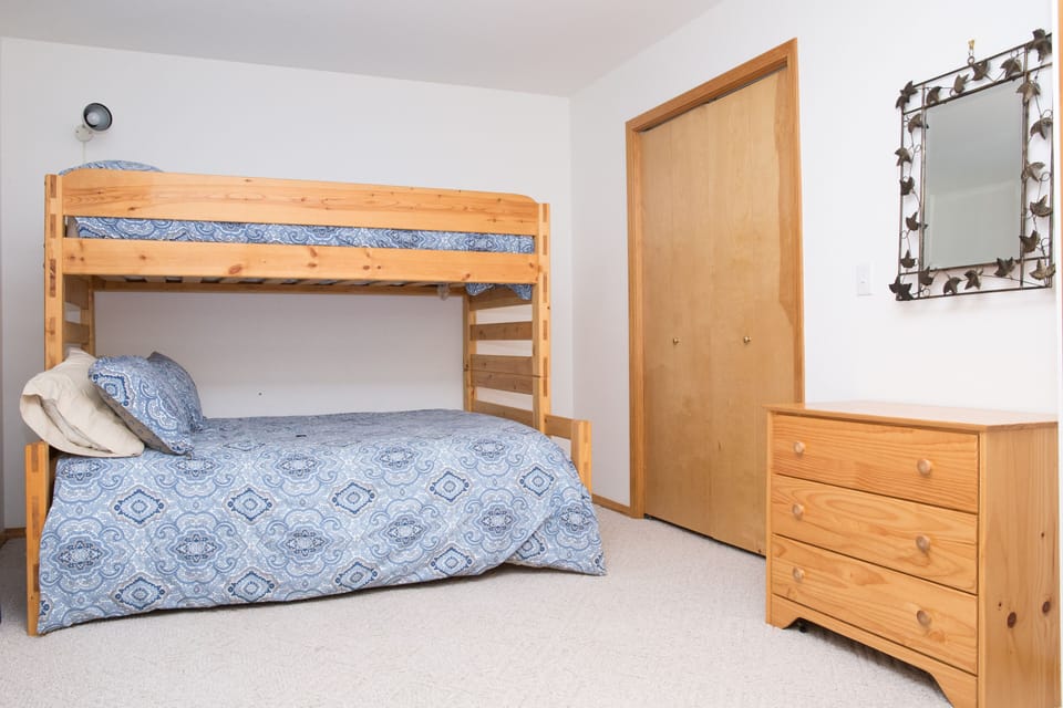Double doors to spacious bedroom1, twin over full bunk, full closet and drawers.