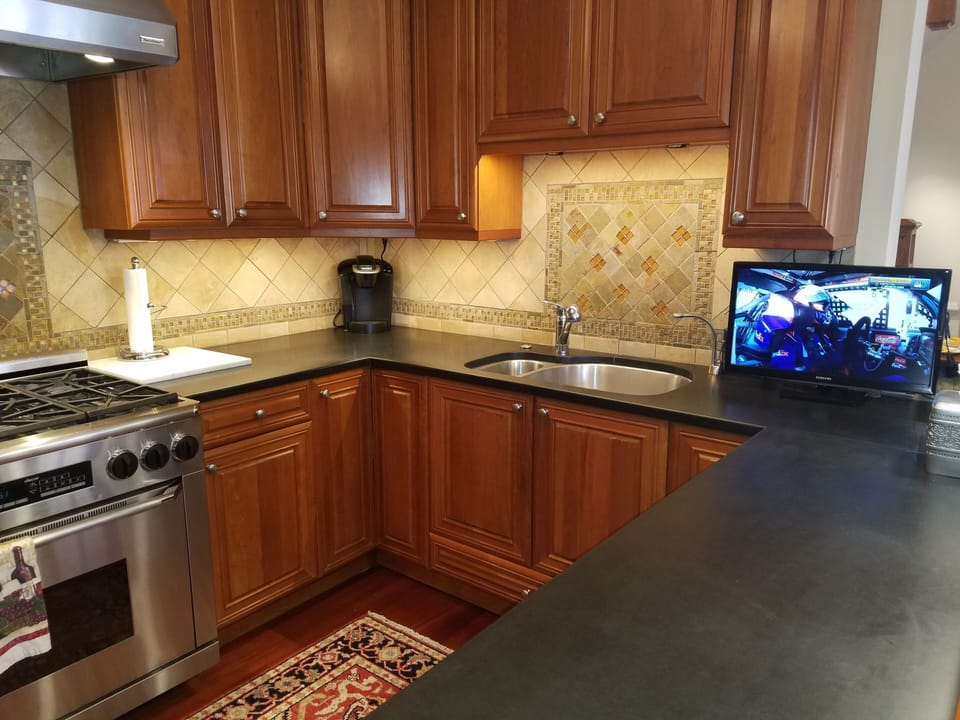 The kitchen is equipped with a TV