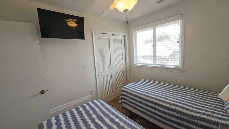 Two Twin beds with TV (alternate view)