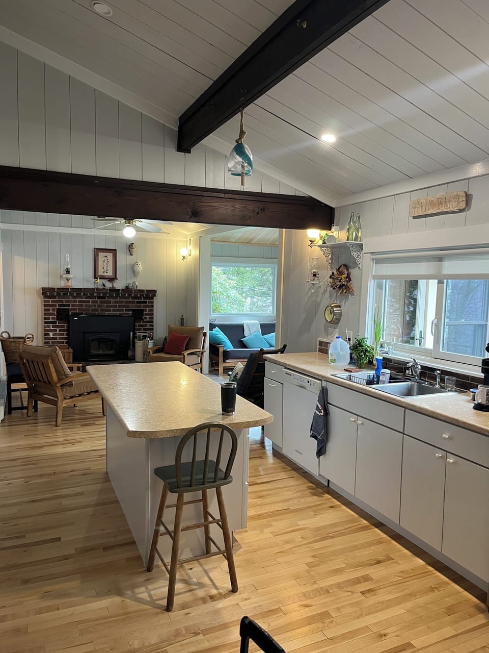 Views from the kitchen to the fireplace and front room