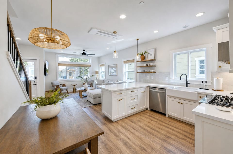 Bright, open-concept space where you'll love cooking and gathering. Enjoy the airy kitchen with its elegant marble counters, modern appliances, and warm wood floors that flow into the inviting living area.