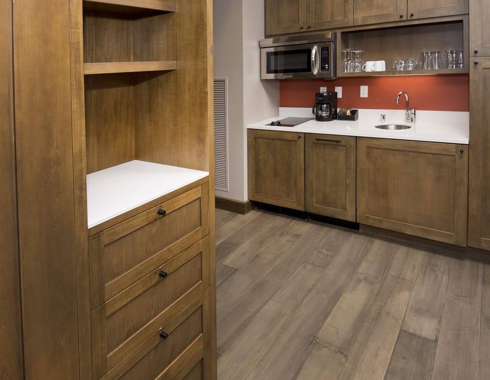 Kitchenette with 2 burner stove, microwave, mini fridge, dishwasher, coffee