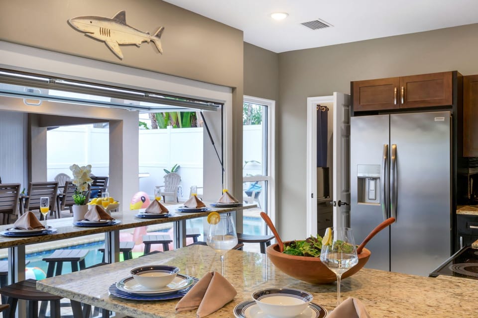 Dining: Ample seating options indoors and outdoors ensure everyone has a place at the table.