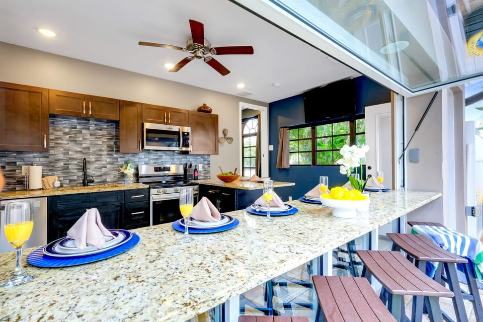 Unique kitchen pass-through bar: Serve lunch directly from the kitchen to the patio bar stools without missing a beat.