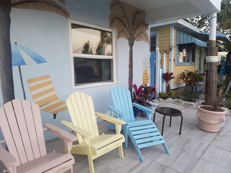 Front porch with overhang, overlooks Shipwreck Bar. Sit here when its raining