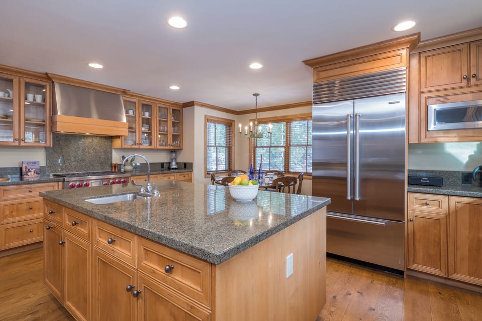Your spacious kitchen invites culinary adventures with granite countertops, premium appliances, and ample prep space for memorable meals together.
