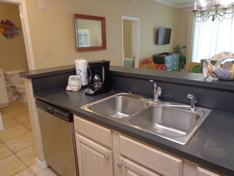 Full kitchen with coffee maker.