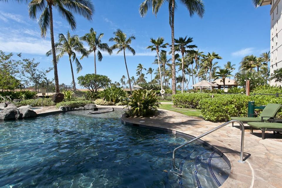 Lounge by the sparkling pool, feel the gentle ocean breeze