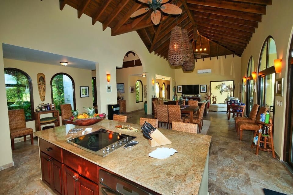 Spacious kitchen and living area with vaulted ceilings and natural light