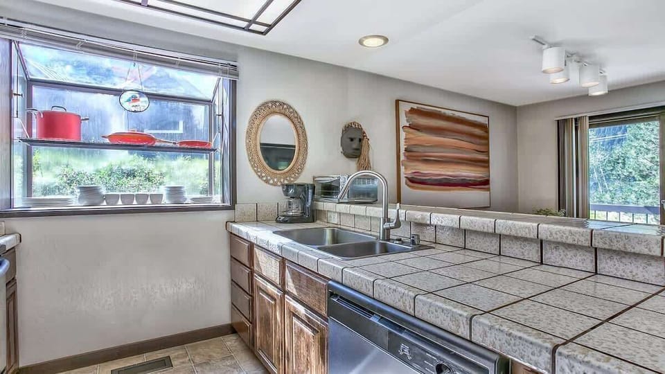 Cozy kitchen with ample counter space, natural light, and everything you need for easy meal prep.