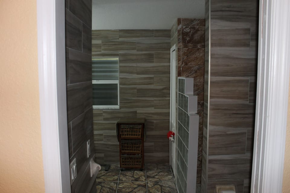 Double marble sinks in the master bathroom with a walk-in closet for extra space