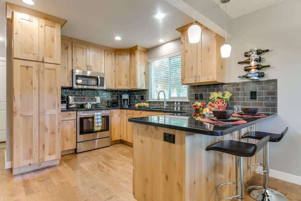 Gorgeous updated kitchen with bar seating, upscale appliances