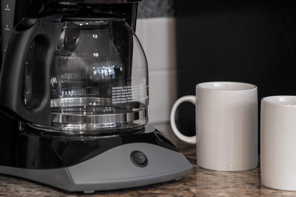 Standard coffee maker. Filters, coffee, sugar and powdered creamer provided by management.