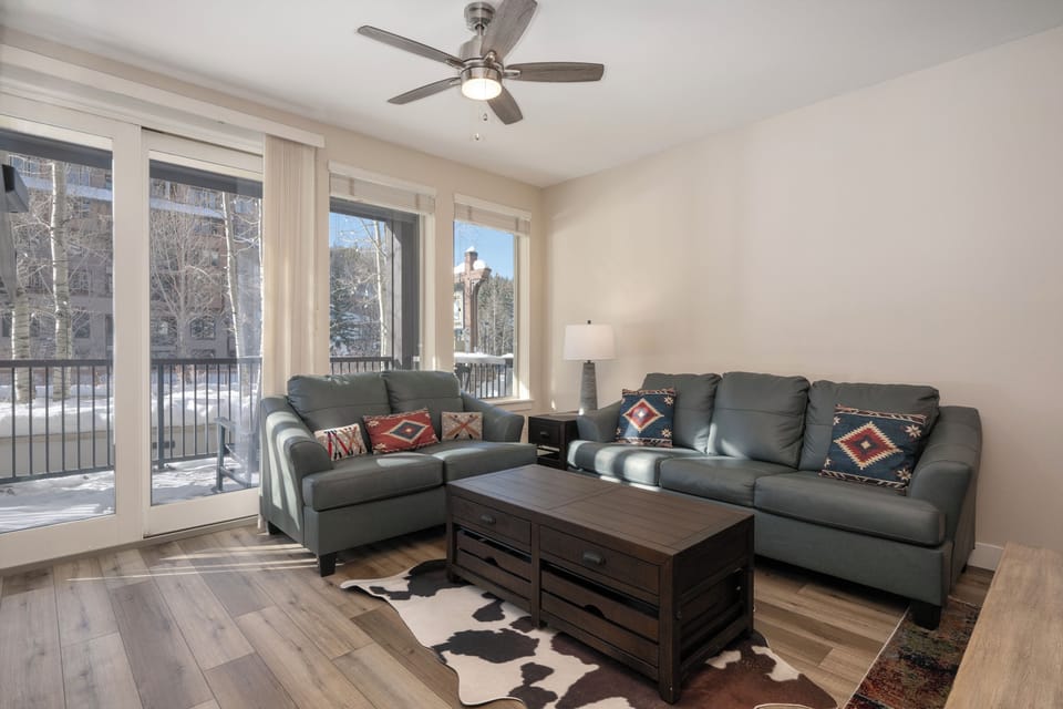 Natural lighting brought in through the large balcony doors and windows.