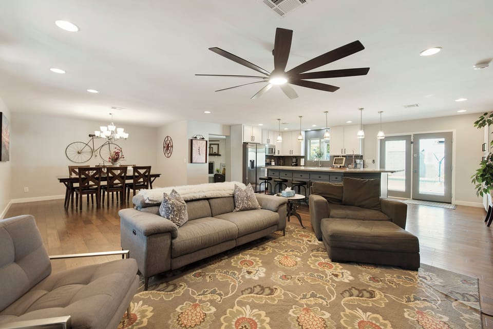 Open-concept layout featuring dining, kitchen, and living areas together.